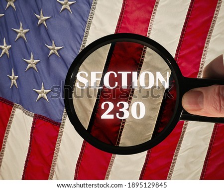 Concept of the american law Section 230 on internet companies. USA flag in the background.