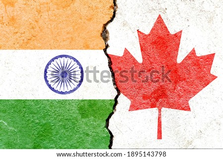 India VS Canada national flags on broken concrete wall with cracks background, abstract India Canada international politics economy culture relationship conflicts concept