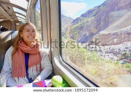 Person on Hiram Bingham Train to Machu Picchu, Peru. Machu Picchu Train. Happy traveler on train to ancient ruin, Machu Picchu, Peru.  Royalty-Free Stock Photo #1895172094