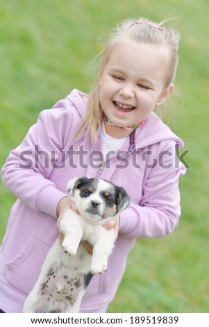 little girl with her puppy chihuahua doggy