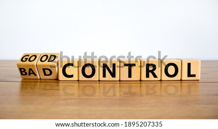 Bad or good control symbol. Turned wooden cubes and changed words 'bad control' to 'good control'. Beautiful wooden table, white background. Business and good control concept. Copy space.