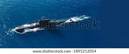 Aerial drone ultra wide photo of latest technology naval armed forces submarine cruising in deep blue open ocean sea Royalty-Free Stock Photo #1895212054