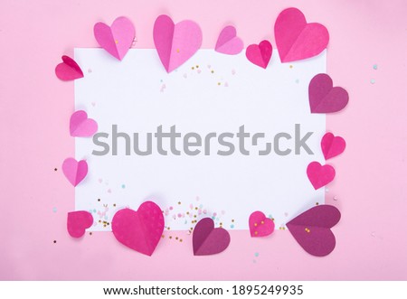 Abstract Background with Paper Hearts and Empty White Frame for Valentine`s Day. Pink Love and Feeling Background for poster, banner, post, card. Top view