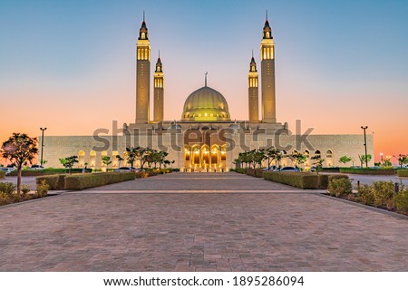 Middle East, Arabian Peninsula, Oman, Ad Dakhiliyah, Nizwa. Sunset at the Sultan Qaboos Grand Mosque. Royalty-Free Stock Photo #1895286094