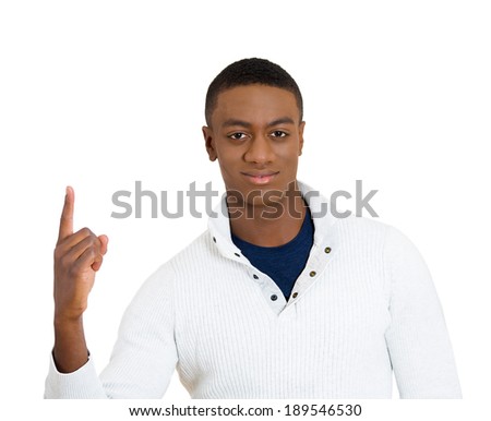 Closeup portrait young student man pointing up having idea, solution, showing with index finger number one, isolated white background. Positive human emotions, facial expressions, symbols, sign