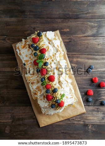 lemon meringue roll cake  with pistachio cream and fresh berries, process of making                            