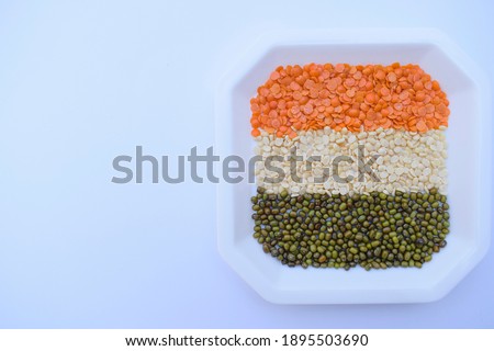 Indian republic day theme concept using tricolors with various pulses, lentils on white background