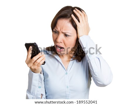Closeup portrait, upset mature woman, shocked surprised, by what she sees on cell phone, isolated white background. Negative human emotions, facial expression feeling