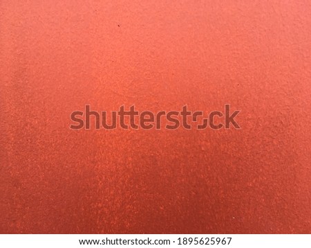 Closeup red wall material texture background 