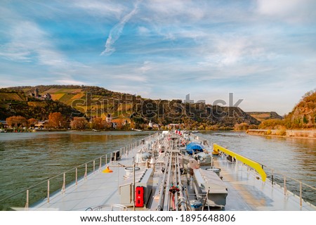 Binnenvaart, Translation Inlandshipping on the river rhein in Germany during sunset hours, Gas tanker vessel rhine river oil and gas transport Germany near Koblenz