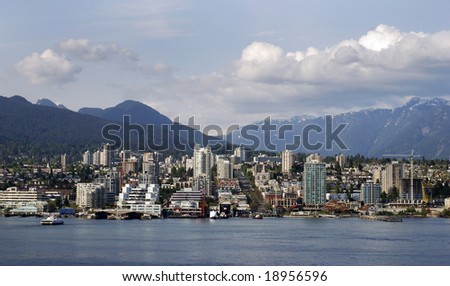 The view of east Vancouver with mountains in a background (British Columbia, Canada).