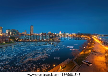 Buffalo New York skyline landscape view at night from erie basin marina.