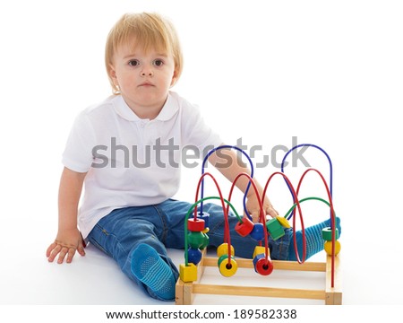 little boy in the classroom at Montessori environment.-concept formation and development of the child. Isolated on white background.