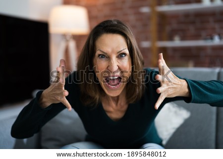 Workplace Quarrel. Angry Looking Woman In Video Conference Royalty-Free Stock Photo #1895848012