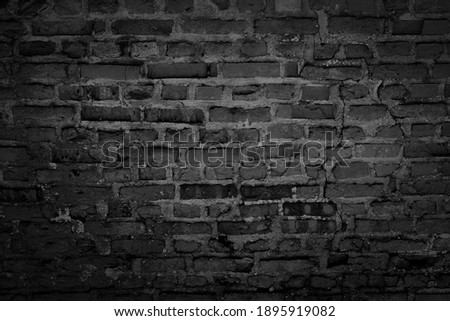 Old brick black colour wall. Vintage background Royalty-Free Stock Photo #1895919082