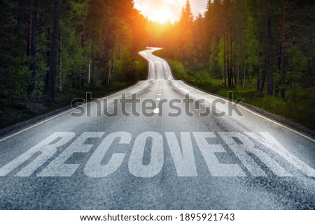 Country road and Recovery written on the road Royalty-Free Stock Photo #1895921743