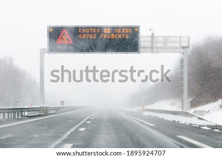 Highway billboard meaning to be careful of snowfall in France