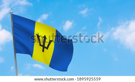 Barbados flag on pole. Blue sky. National flag of Barbados