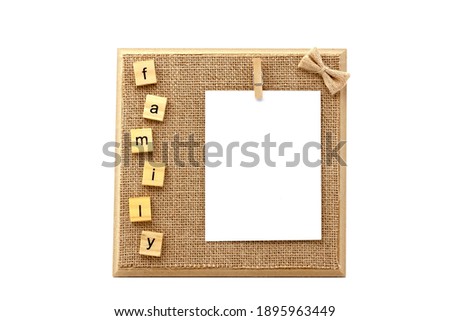 Vintage wooden photo frame with natural fiber rope, with white copy space. Selective focus with shallow depth of field.