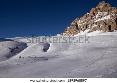 a beautiful snowy mountain panorama, the Dolomites covered by snow
