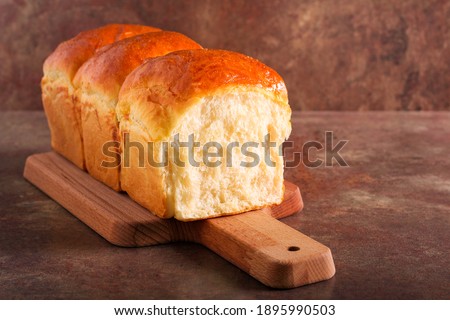 Homemade soft, fluffy white bread loaf, Japanese milk bread Royalty-Free Stock Photo #1895990503