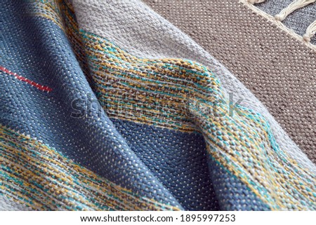 braided texture. Striped knitted or braided fabric. Needlework and comfort