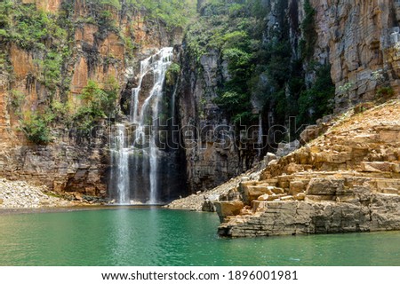 View to a waterfall with turquoise waters in the city of Capitolio, Minas gerais - Brazil
