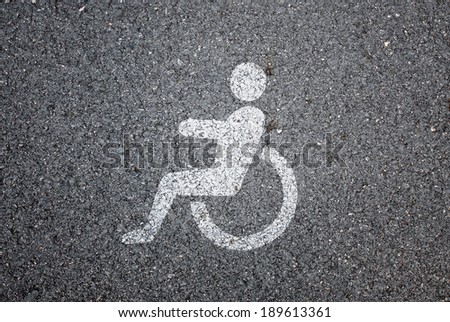 Disabled icon sign on the road background