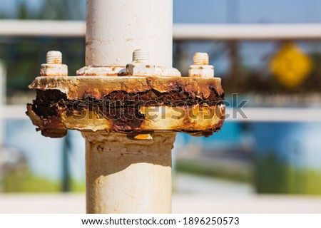 Rust damage paint and corrosion flange on the roof tank Royalty-Free Stock Photo #1896250573