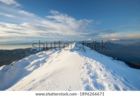 snowy mountains clouds  row mountains  sunset  blue