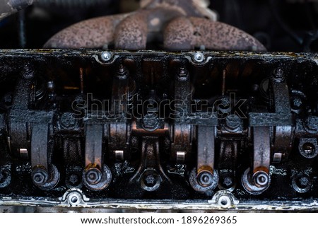 Dirty Valves and engine camshaft inside a broken engine Royalty-Free Stock Photo #1896269365