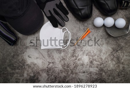 golf ball and accessories on floor