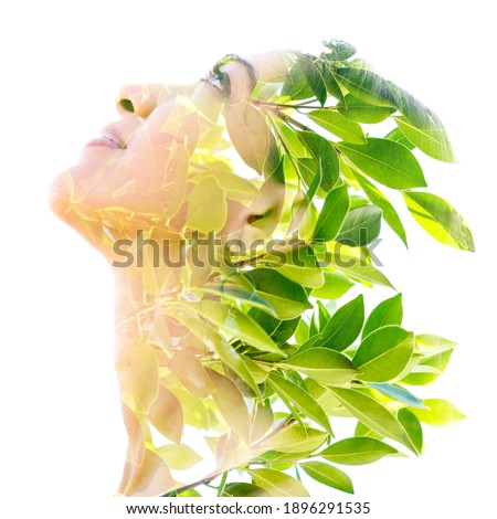 An isolated portrait of a woman combined with fresh green leaves