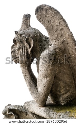 Gargoyle or chimera of Notre Dame de Paris isolated on white background, France. Gargoyles of this cathedral are Gothic landmark in Paris. Famous statue of pensive demon close-up. Travel theme.