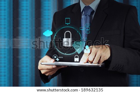 businessman hand pointing to padlock on touch screen computer as Internet security online business concept  Royalty-Free Stock Photo #189632135