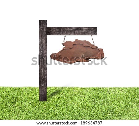 Old wooden sign isolated on background of nature.