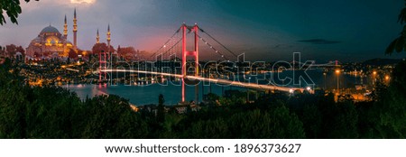 Istanbul Bosphorus panoramic photo. Istanbul landscape beautiful sunset with clouds Suleymaniye Mosque double exposure, Bosphorus Bridge,  Istanbul Turkey.Best touristic destination of Istanbul Royalty-Free Stock Photo #1896373627