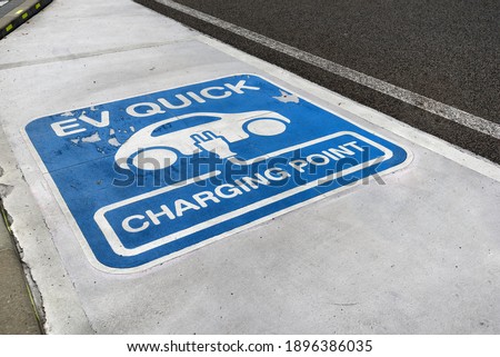 Charging station for electric vehicles at the Public road and car parking, EV quick charging point.