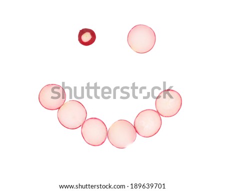 Radish slices in form of crazy smile. Isolated on a white background.