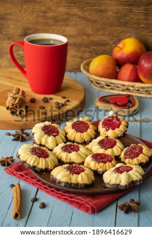 
composition red cup of coffee and cookies, breakfast on a wooden background, sweets, heart, valentines day
