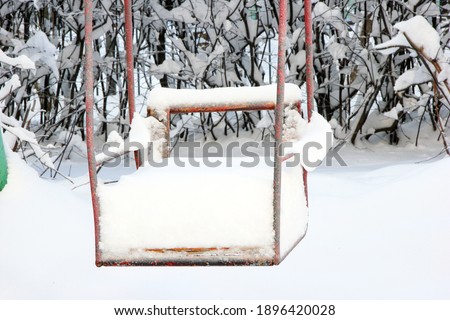 Snow-covered playground for the morning after the snowfall