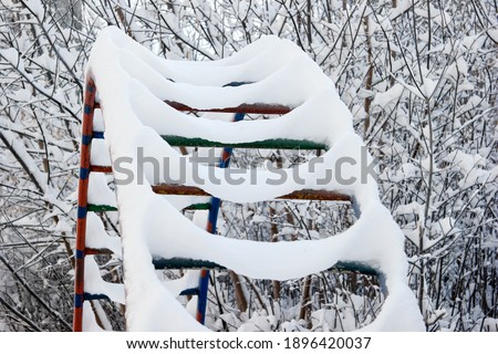 Snow-covered playground for the morning after the snowfall