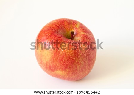 Honeycrisp apple close up. White background. Royalty-Free Stock Photo #1896456442