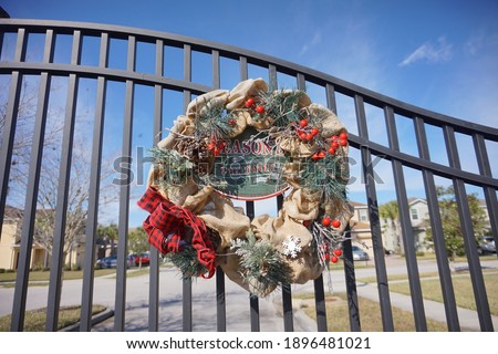 Christmas green pine decoration in front of a house	