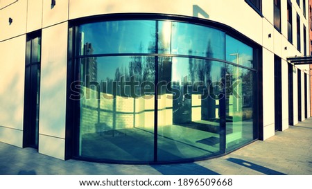 Panoramic windows of new commercial premises. Commercial property in development standard for rent. Retro stylized colorful tonal filter effect.
