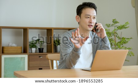Young man talking on smartphone