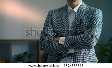 Young man with arms folded Royalty-Free Stock Photo #1896553318