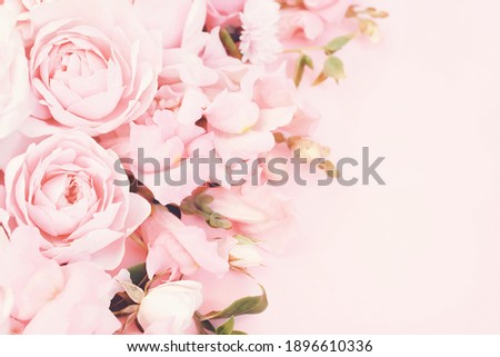 Vintage toned pink rose flowers frame, blooming pastel festive background, soft pink bouquet floral card, selective focus	