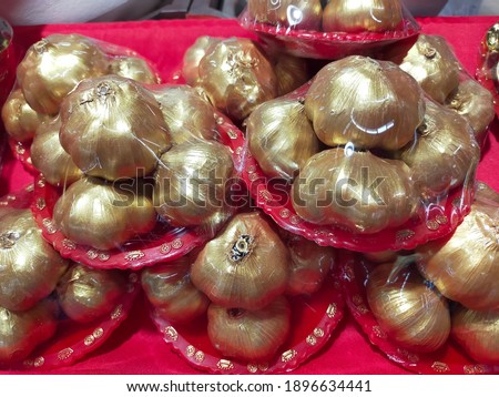Golden Garlic is one of the powerful feng shui products. It signifies a lot of good opportunities coming to you. In addition, golden garlic also presents wealth. Selective focus.