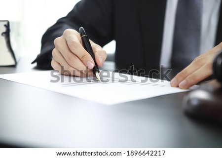 Justice and Agreement concept. Lawyer working with documents in office
 Royalty-Free Stock Photo #1896642217
